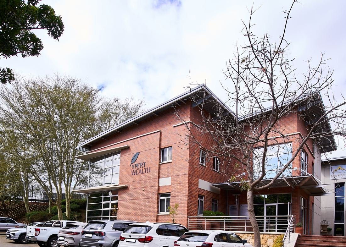 The XPert Wealth offices in Faerie Glen, Pretoria East, with the XPert Wealth signage on the brick facade